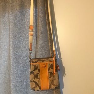 Coach crossbody with orange accent color